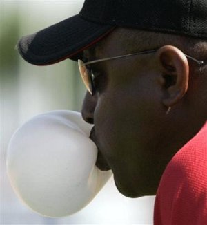 New first base coach Billy Hatcher demonstrates appropriate infield chewing gum form.