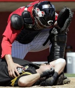 LaRue checks on Casey after a beaning to the head.