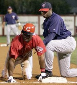 Tony Womack successfully stretches a double into an out during Monday's game against the Twins.