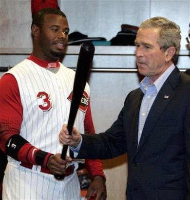 President Bush admires Ken Griffey Jr.'s fine piece of lumber.