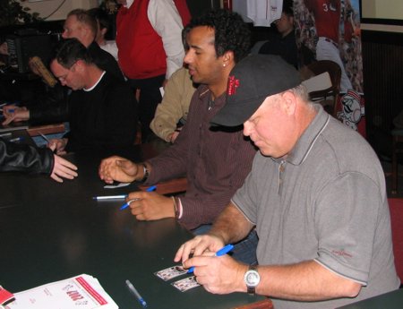 Signing autographs in front of the big screens