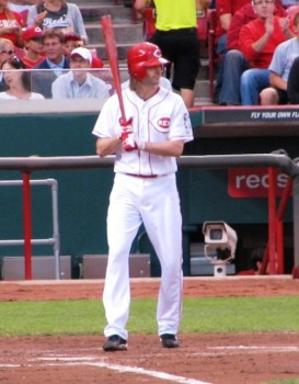 Bronson Arroyo and his red bat move towards the batter's box.