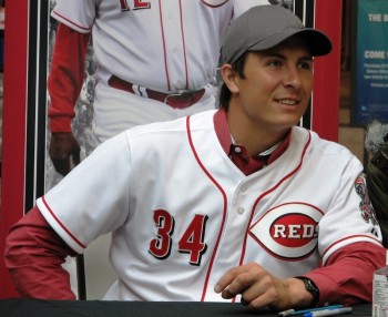 Homer Bailey smiles as he leans in for a forbidden photo with a fan during Reds Caravan.