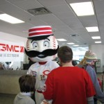 Mr. Redlegs entertains kids waiting in the line.