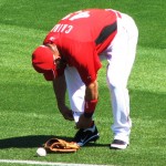 Cairo ties his cleats Cairo ties his cleats