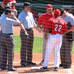 First base coach Hatcher hands off the lineup card First base coach Hatcher hands off the lineup card