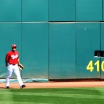 Heisey catches a ball at the outfield wall Heisey catches a ball at the outfield wall