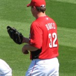 Bruce preparing his glove for some warmup tossing. Bruce preparing his glove for some warmup tossing.