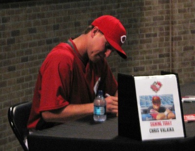 Valaika working out his autographing muscles