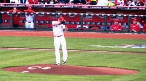 Latos winds up to deliver the first pitch