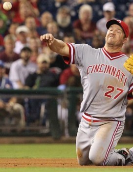 Rolen throwing from his knees