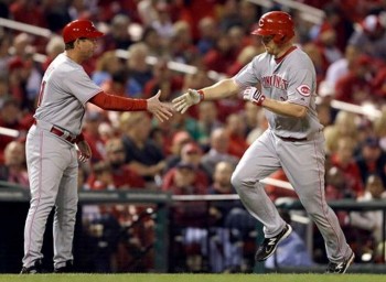 Mark Berry offers congratulations to Scott Rolen after a game-tying home run.