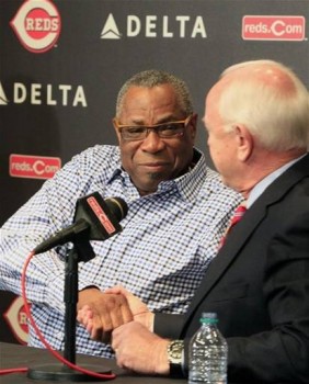 Cincinnati Reds manager Dusty Baker, left, shakes hands with general manager Walt Jocketty during a news conference where the Reds announced Baker's contract had been extended for two seasons, Monday, Oct. 15, 2012, in Cincinnati. (AP Photo/Al Behrman) Via Yahoo Sports