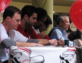 Jay Bruce, Ryan Lamarre, Corky Miller, Phil Castellini, and Thom Brennaman on the dais, signing merchandise for fans.