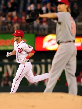 Bronson Arroyo waits for a new ball after Bryce Harper lost one in the seats.