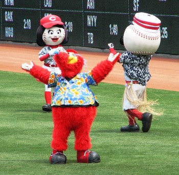 The Reds mascot wear tropical shirts to honor the Beach Boys