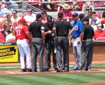 Hatcher delivers the lineup card to the umpires