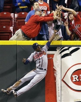 Mexoraco's home run was just barely over the wall, which is just fine with these front-row fans. (AP Photo/Al Behrman)