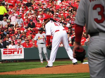 Cueto checks the runner.