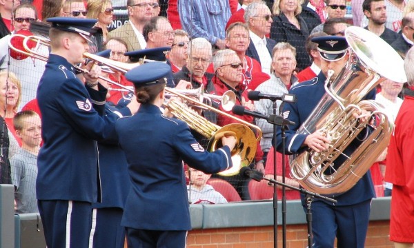 A brass band plays God Bless America.