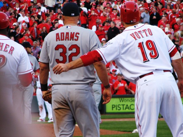 Votto hands his batting gloves to Hatcher.