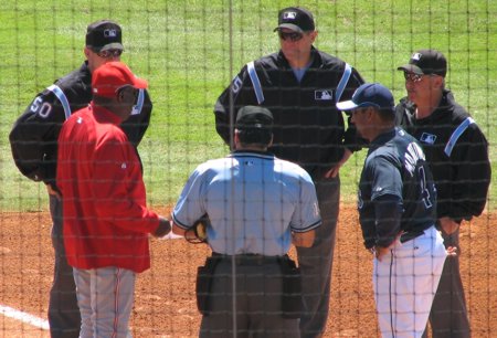 Think he's telling them about how he used to be a good manager?