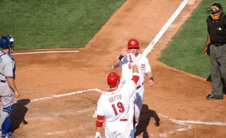 Votto high-fives Stubbs for scoring