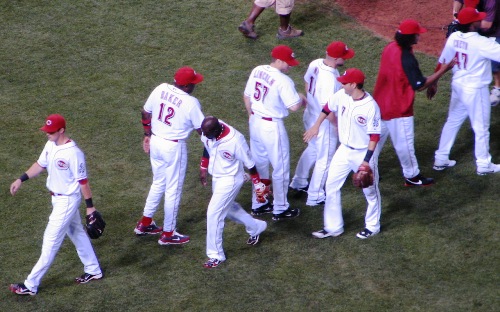 Phillips high fives Baker down low after the good guys win