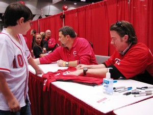 Hanigan signing autographs.