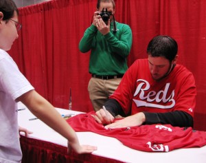 Ondrusek signs a jersey.